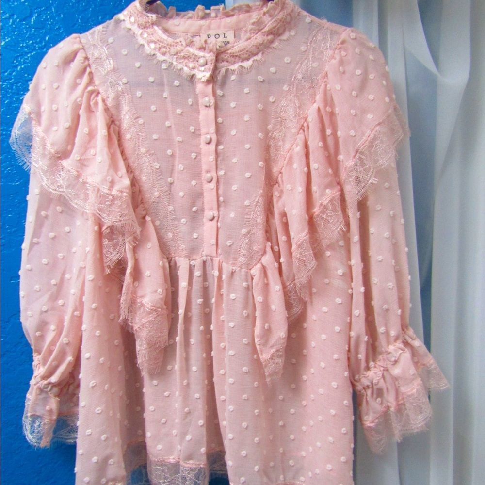 Swiss dot pink ruffle blouse with front buttons and lace detail